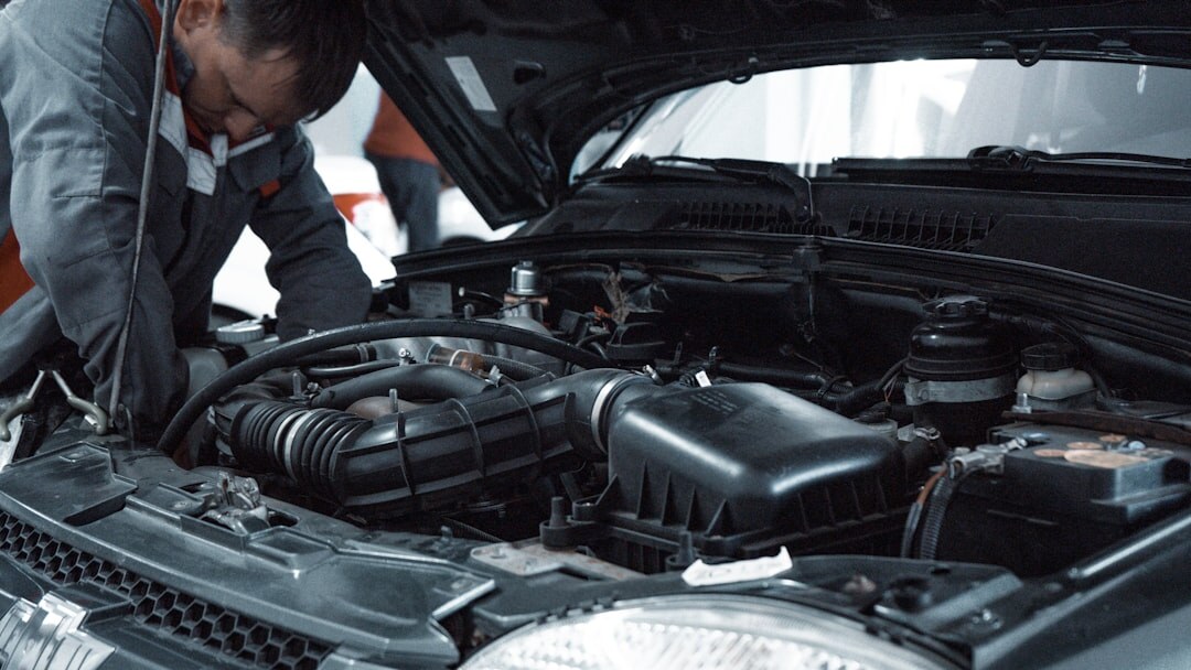 mechanic checking engine