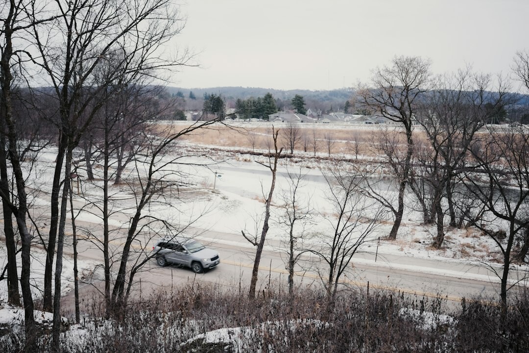 Silver pickup truck on a rural road