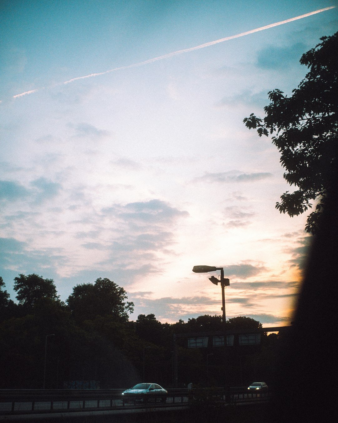 car on highway at sunset